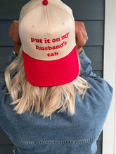 Load image into Gallery viewer, Put It On My Husbands Tab Trucker Hat